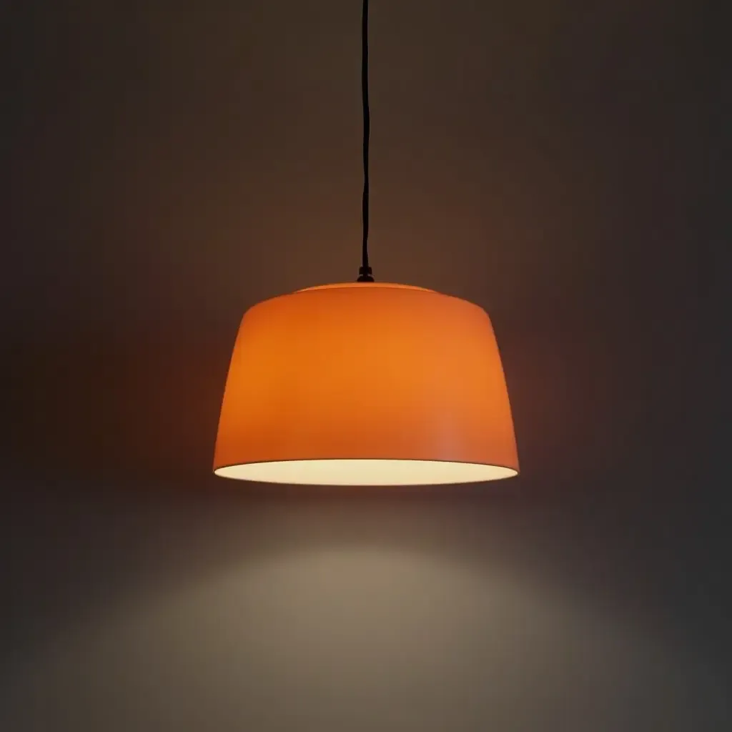 a photo of a sophisticated lighting fixture in orange and navy