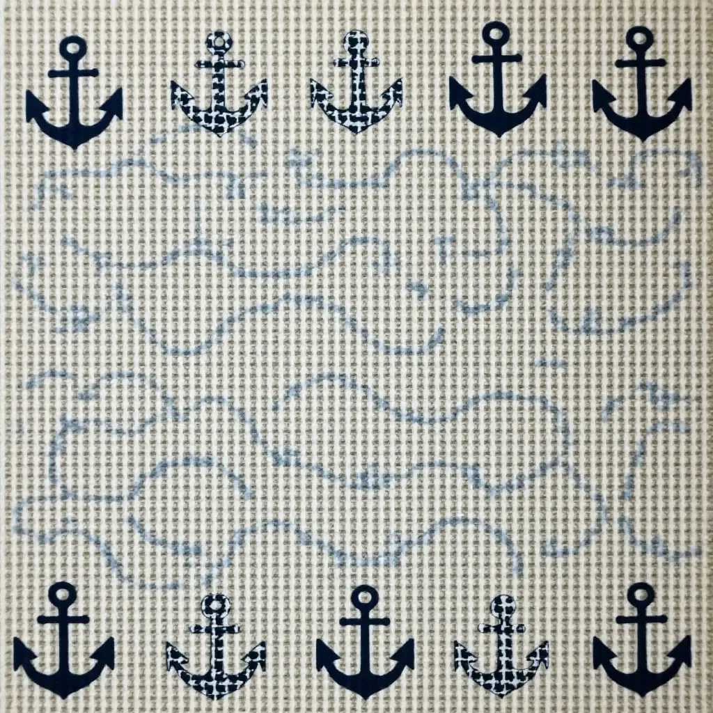 a photo of a nautical-themed rug with anchors and waves